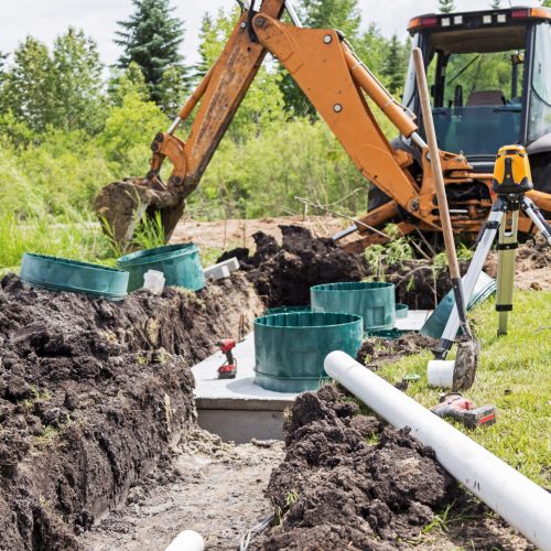 Scene of a construction site installing a new mound septic system.