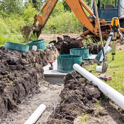 Mound Septic System Installation Scene of a construction site installing a new mound septic system.