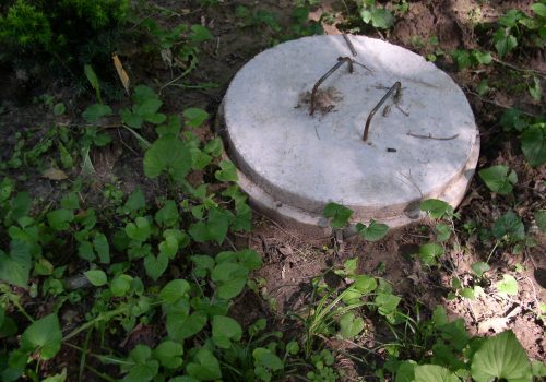 Septic Cover Modern septic systems treat waste water in rural areas of U.S. Constant maintanance keeps systems working properly and reduces pollution. See also Winter (1041266), and Fall (340764).