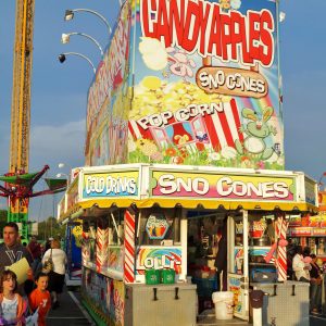 Food Stall at Summer Carnival Media, PA, USA – May 17, 2014: People wait in line to buy snack food at a traveling summer carnival.